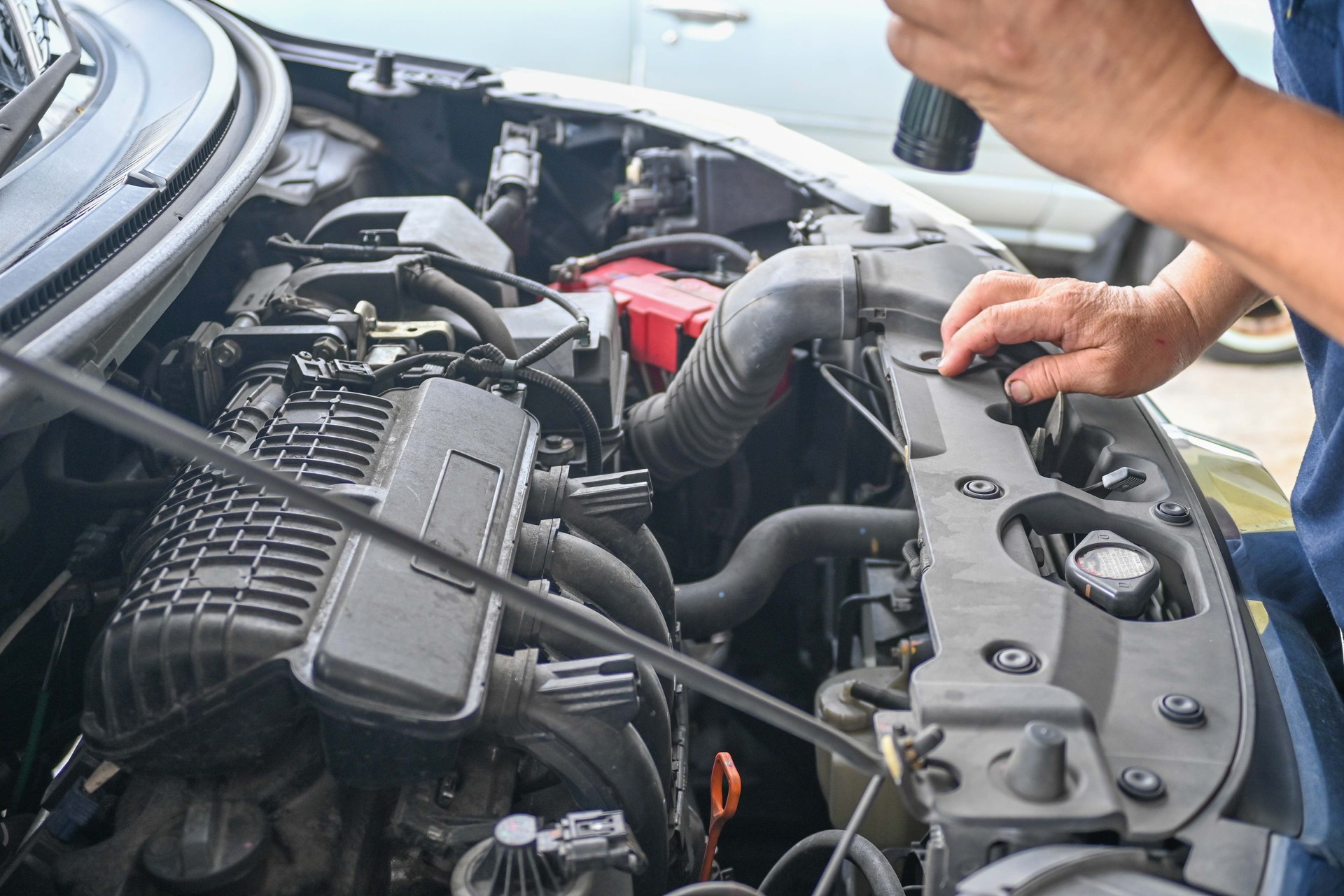 Car mechanic working in auto repair service