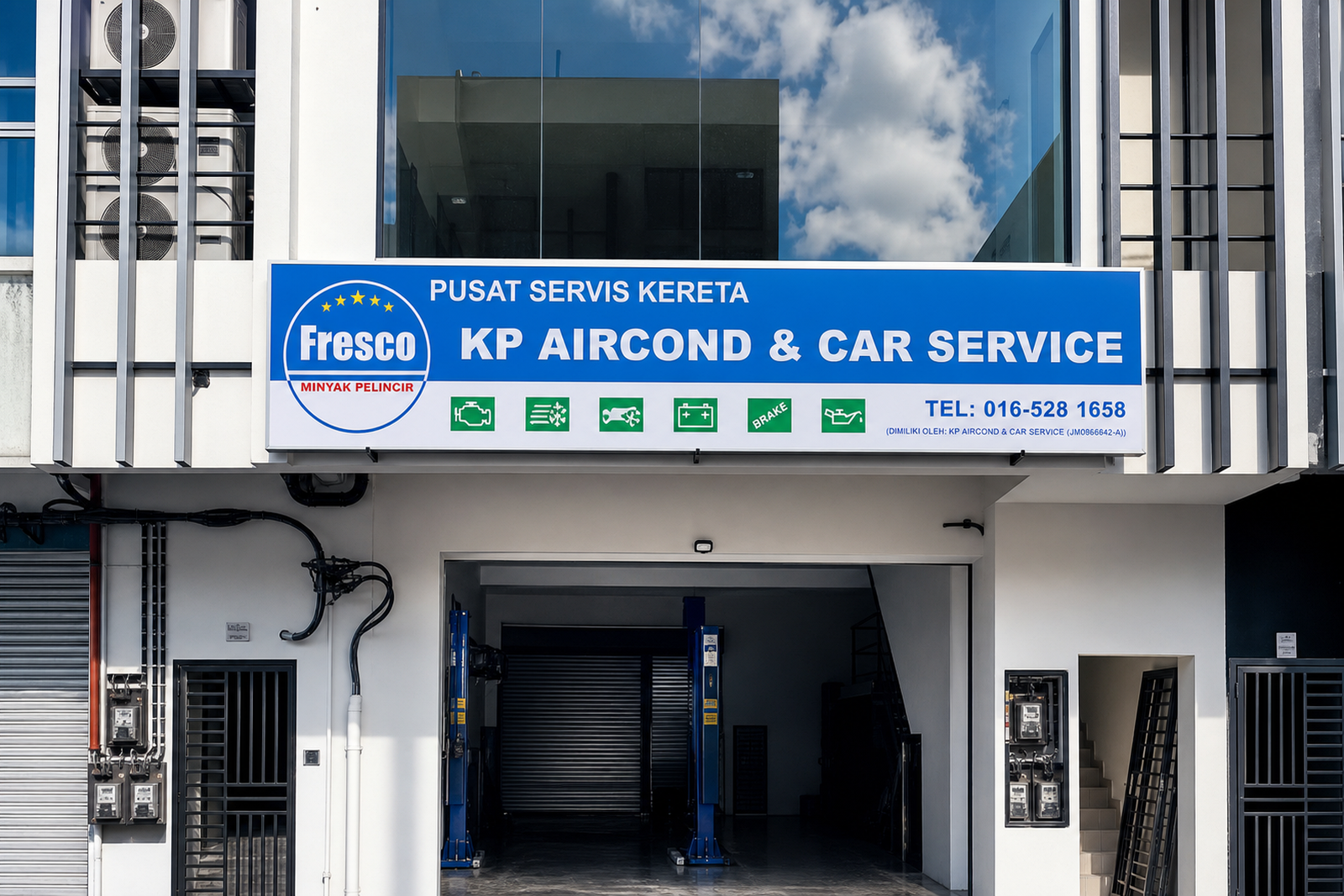 Polished storefront view of KP Aircond & Car Service signboard in Masai