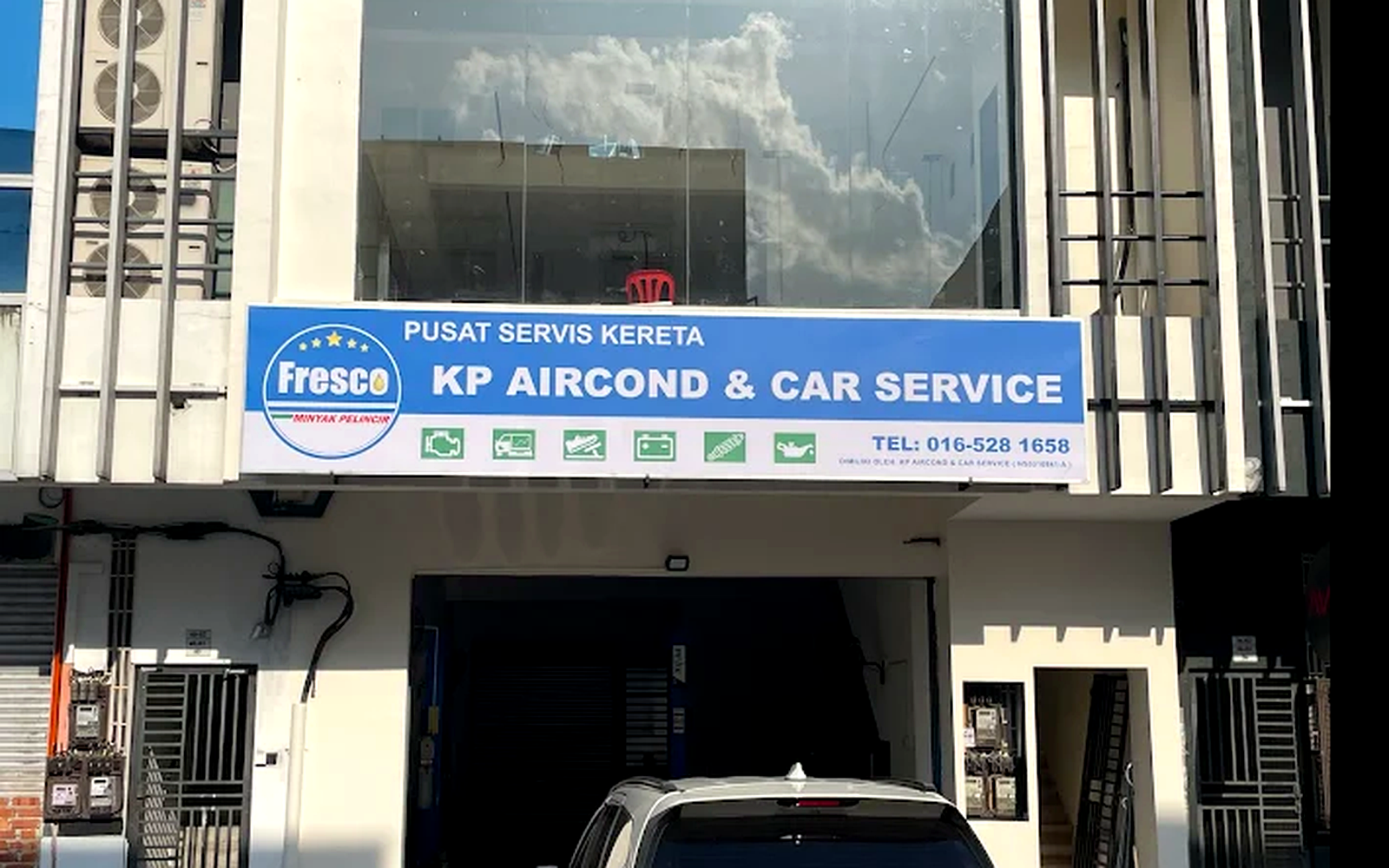 Actual KP Aircond & Car Service storefront signboard in Masai